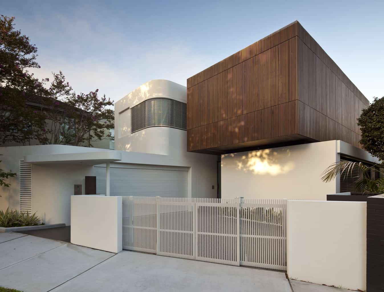 Curved concrete form with finely slatted timber cocoon