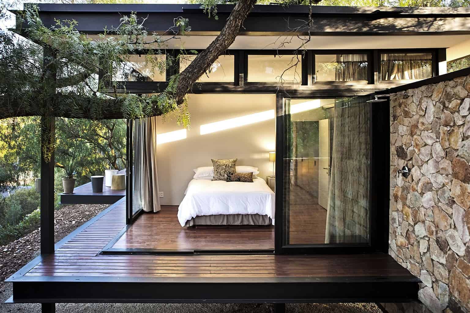 Pavilion architecture with floating stone wall